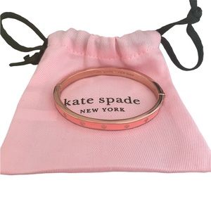 Kate Spade bangle melon colour with rose gold. Includes bag.